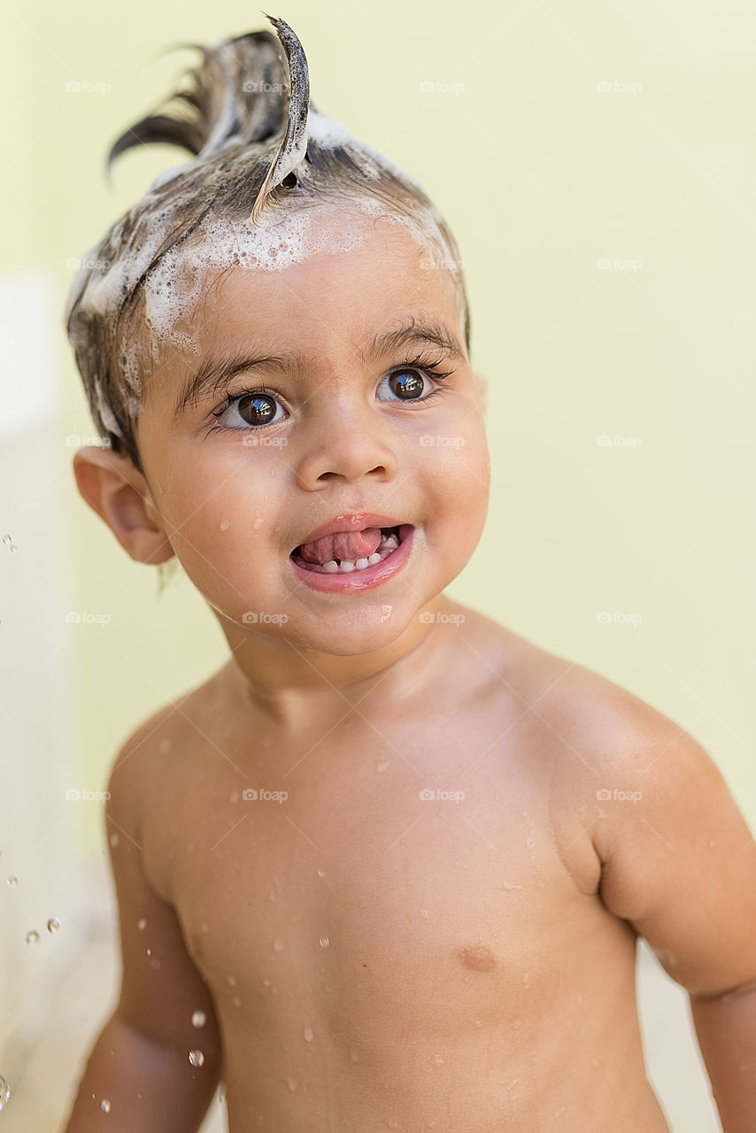 Close-up of a boy taking bath