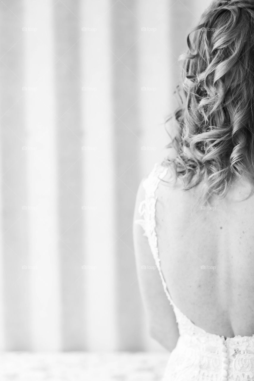 Black and white portrait of half of bride back and hair on wedding day