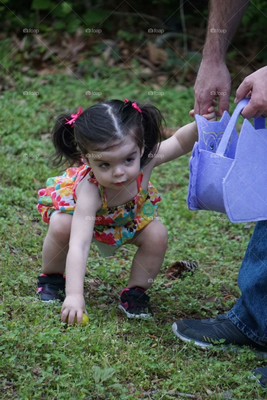 My daughter Easter egg hunting with her father. 