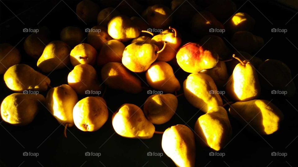 Healthy for you pears in the golden sunshine.