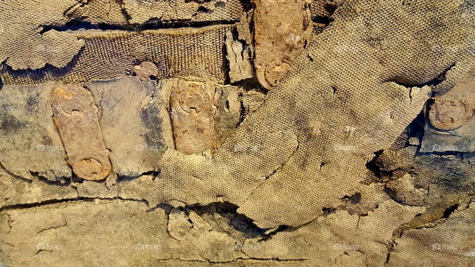 a small section of an old mining conveyor belt from the turn of the 20th century. It had been left to rot until this section was encased in glass at a museum.