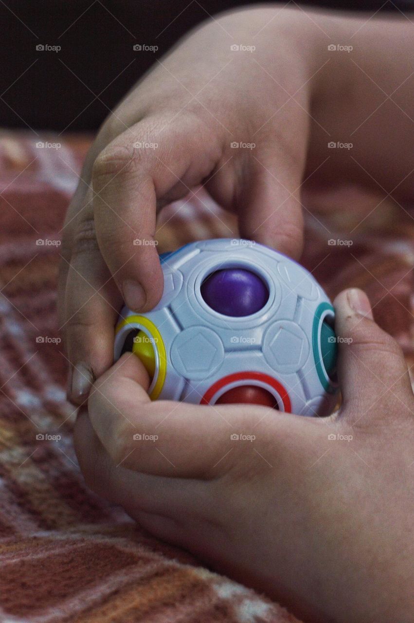 puzzle toy in the hands of a child