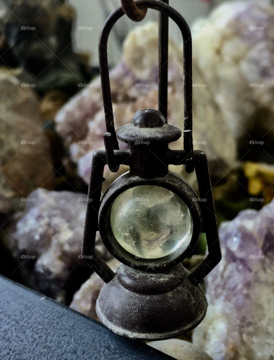 Rock lantern surrounded by amethyst  