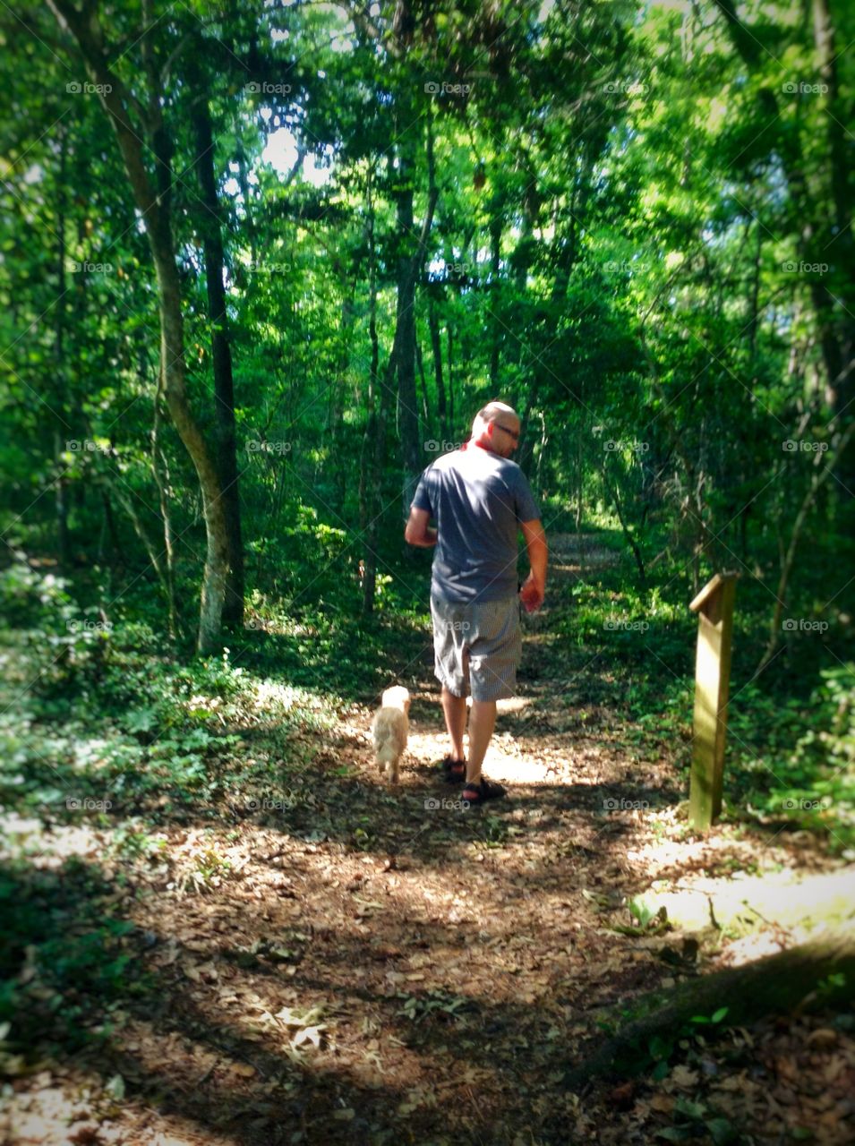 A man and his dog.. An early walk down the trail in Myrtle beach SC.