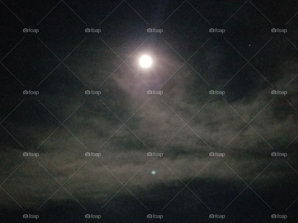 Clouds rolling in front of the clouds before a Lunar Eclipse.