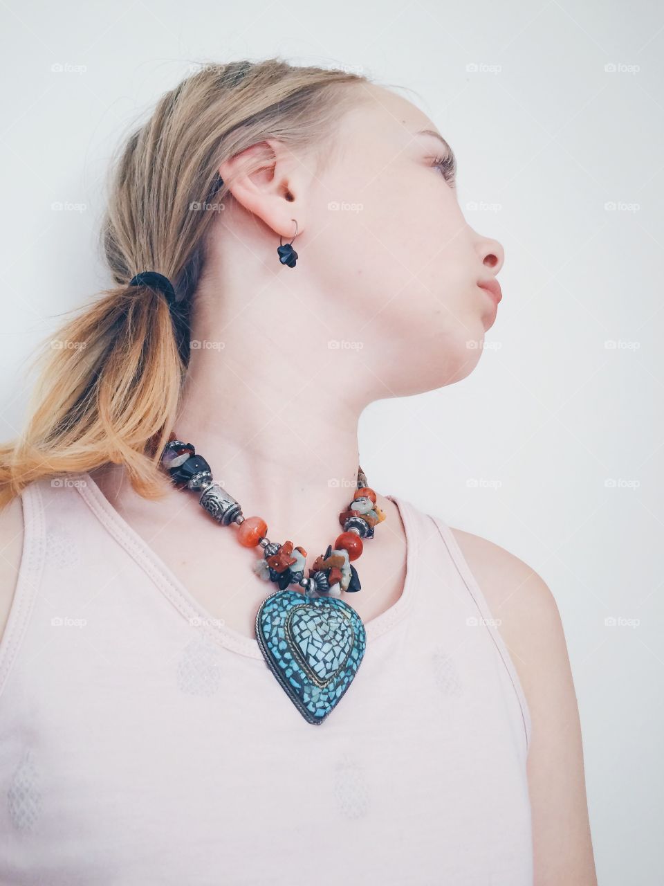 Jewelry. Girl wearing a heart necklace