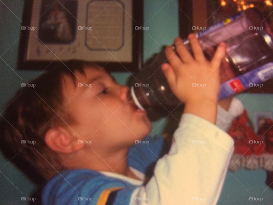 Cute child drinking water