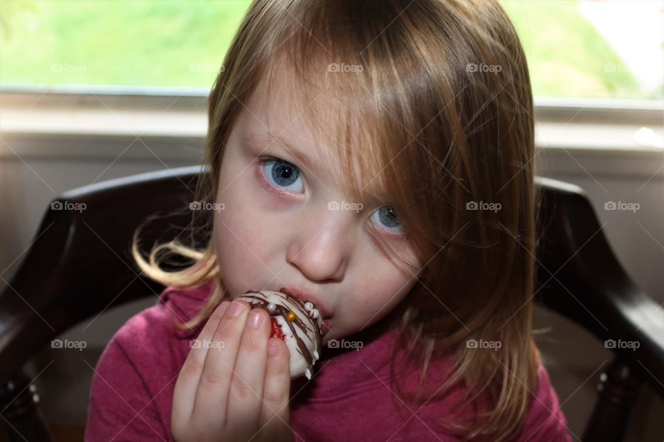 eating chocolate strawberry