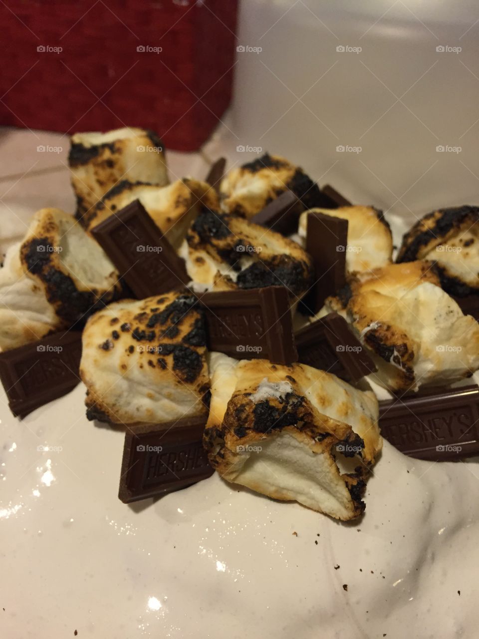 Toasted marshmallows and Hershey's Chocolate top a chocolate s'more cake! 