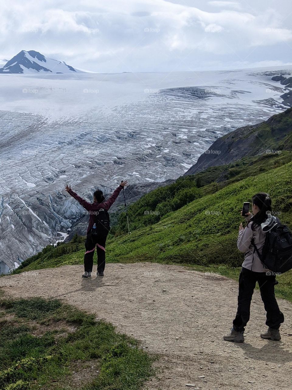 staging a photomoment in front of a glacier