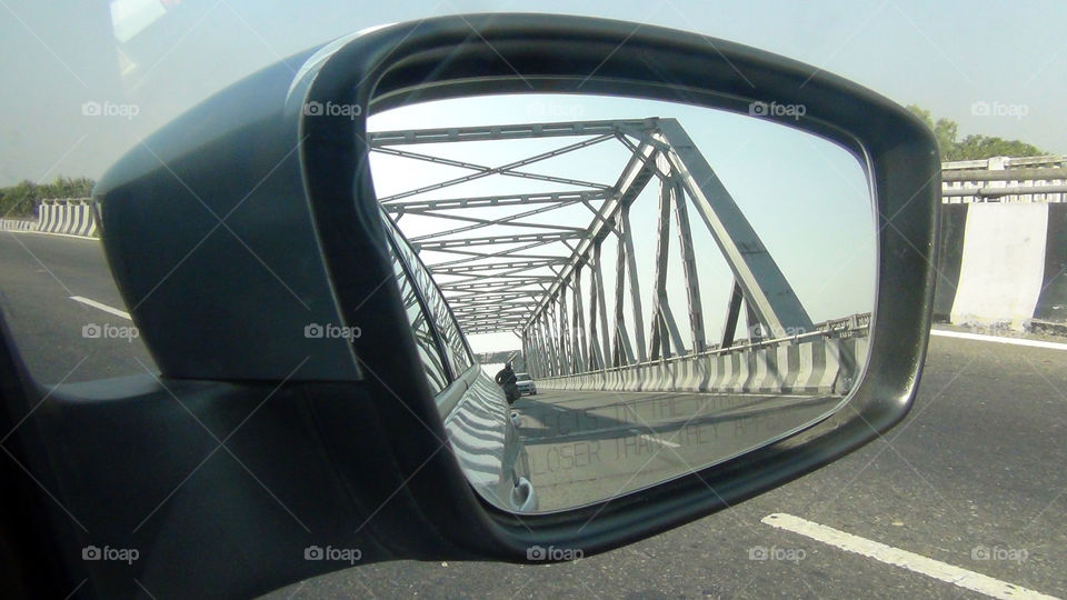 A bridge seen through a mirror - certain moments make themselves standout even though so ordinary.