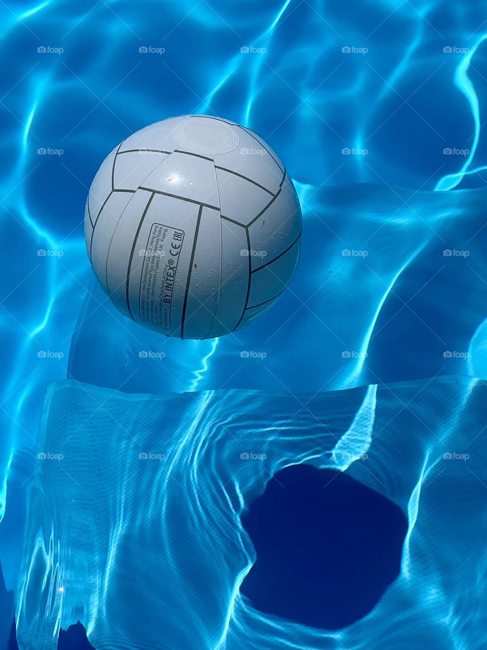 Plastic ball in a pool.
