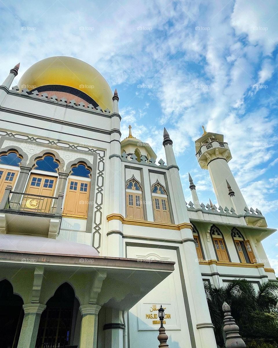 Golden domes of the Sultan Mosque for Islamic worship. 