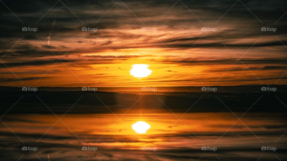 Sun basking within it’s own reflection.