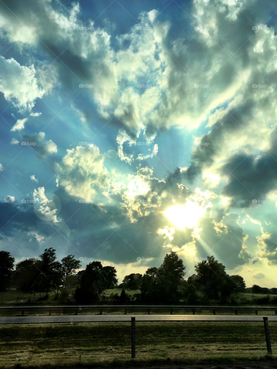 Lots of big clouds with the sun seeping through