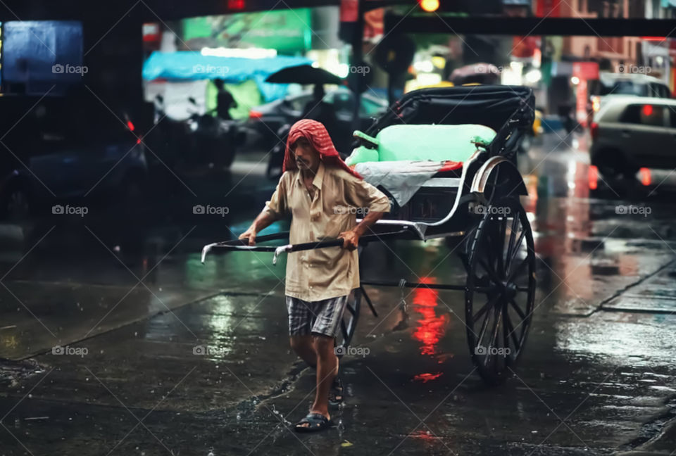 Man Pulling Hand Rickshaw In Kolkata, India