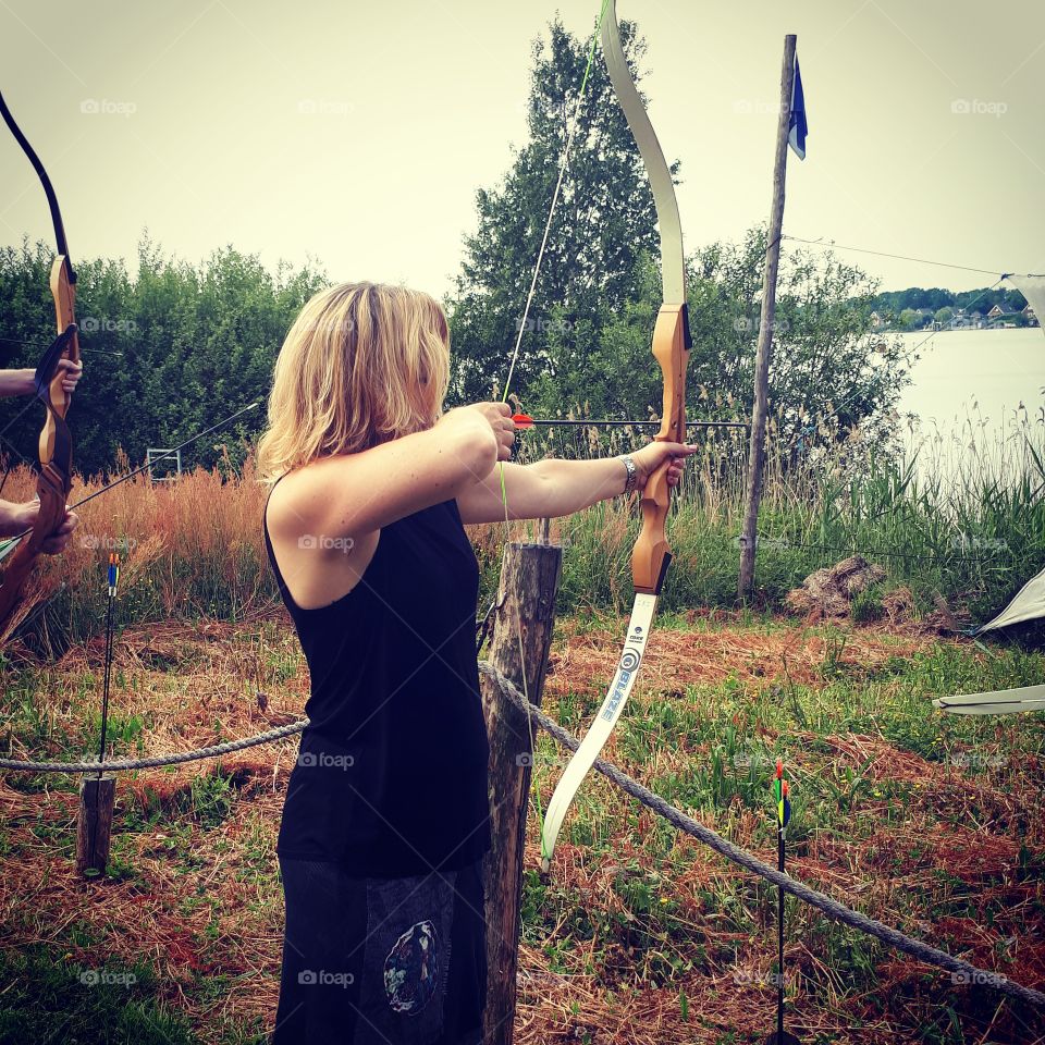 fun day outdoors, shooting with different bow and arrows.