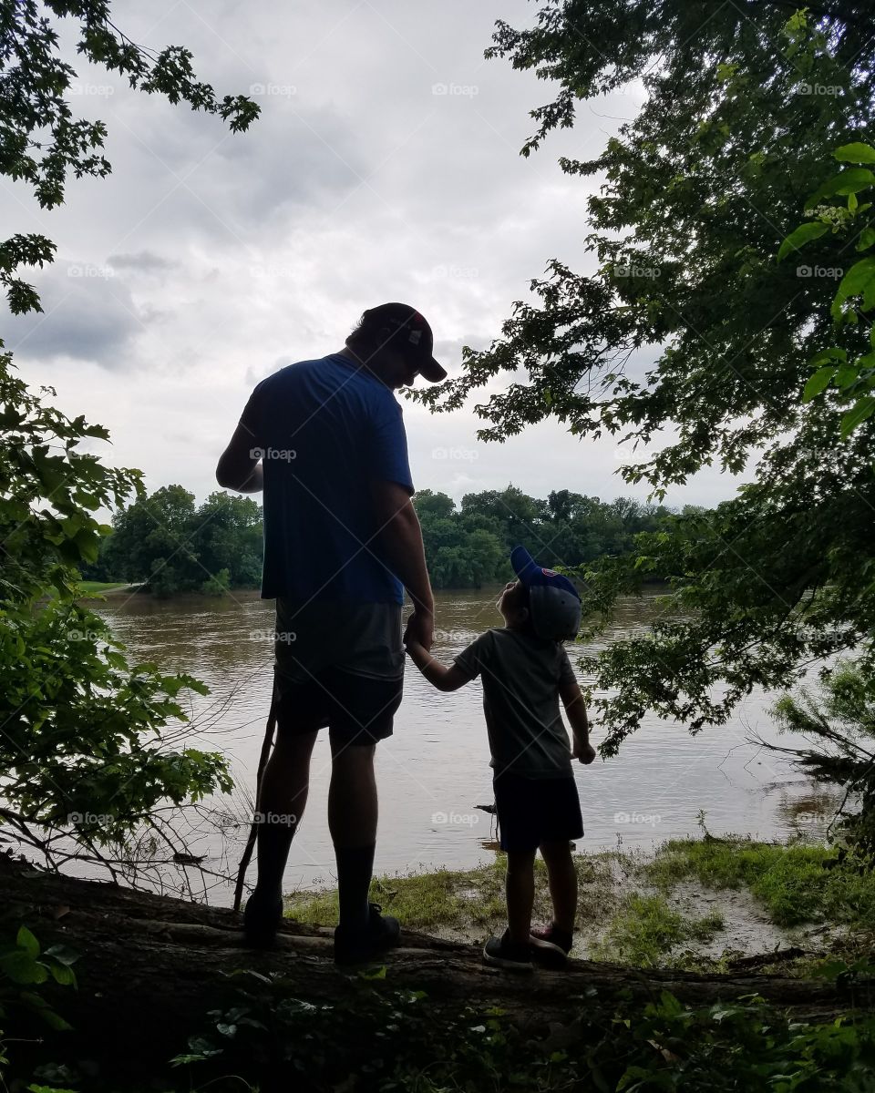 Father and son exploring the river