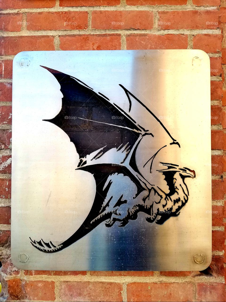 metal plaque sign brick dragon