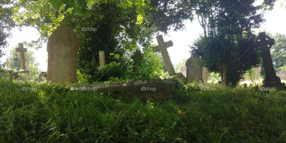 leaning old graves in anciant cemetery