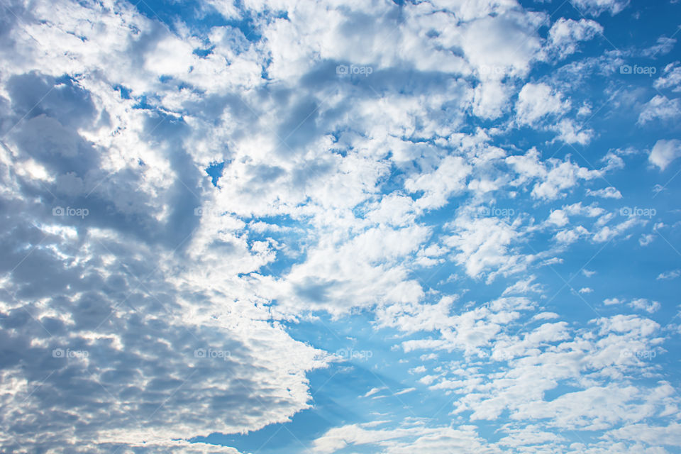 The beauty of the sky with clouds and the sun.