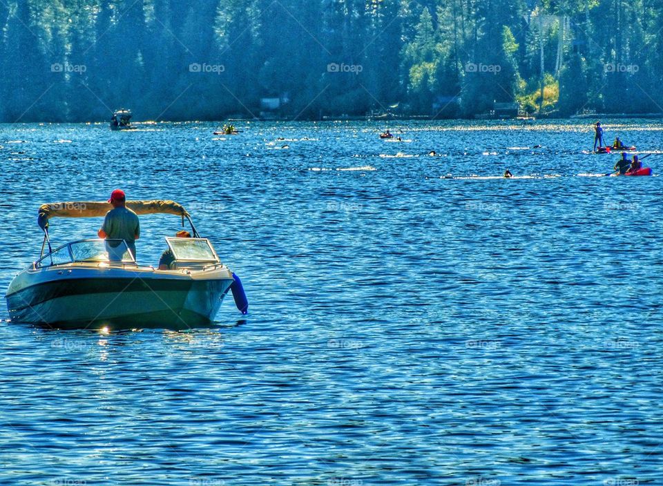 Mountain Lake Full Of Watercraft. American Summer Vacation On A Lake
