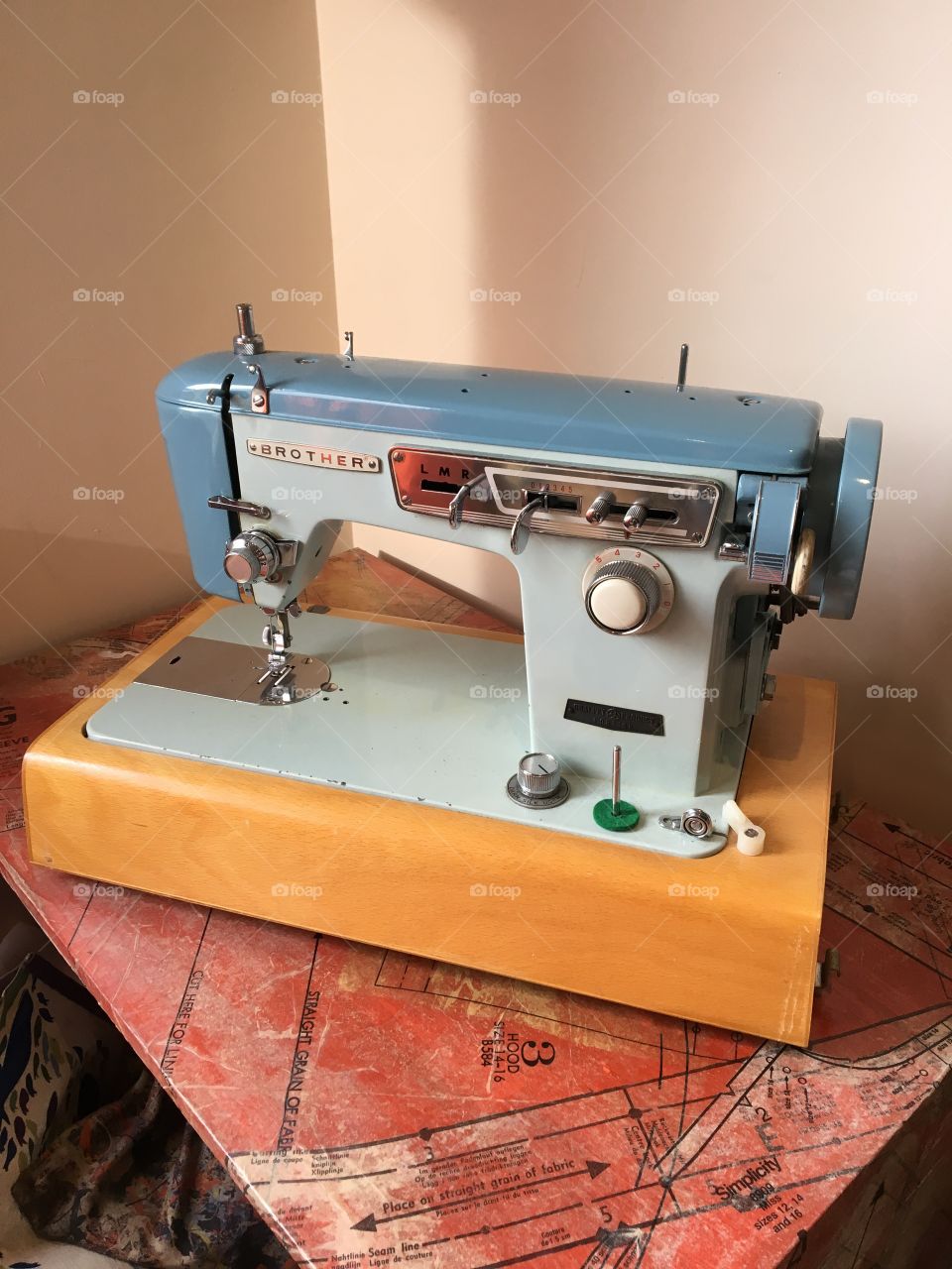 Beautiful vintage semi industrial sewing machine. Blue metal on a wooden base 