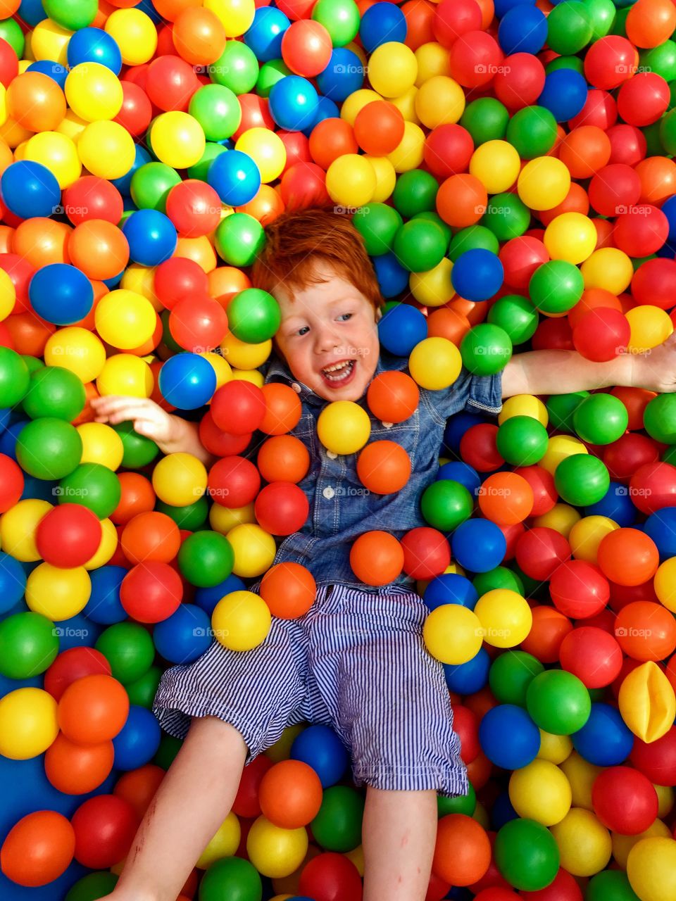 Child in a ball pit 