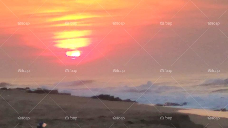 Sunrise on a choppy beach