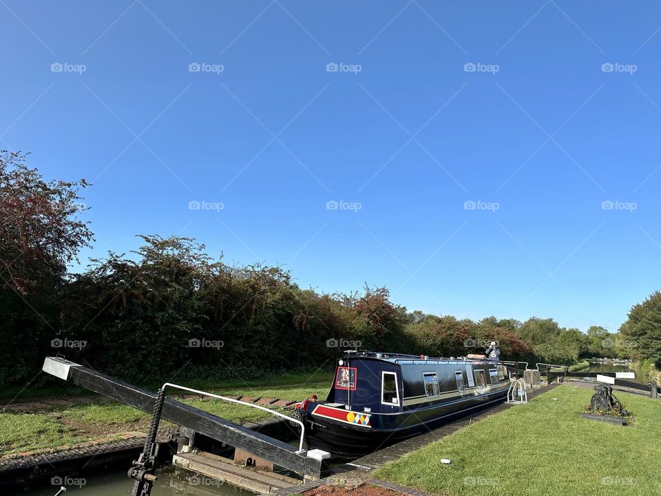 Hillmorton locks near Rugby Oxford canal England narrowboat cruise holiday vacation historic waterway gorgeous clear sky late summer weather