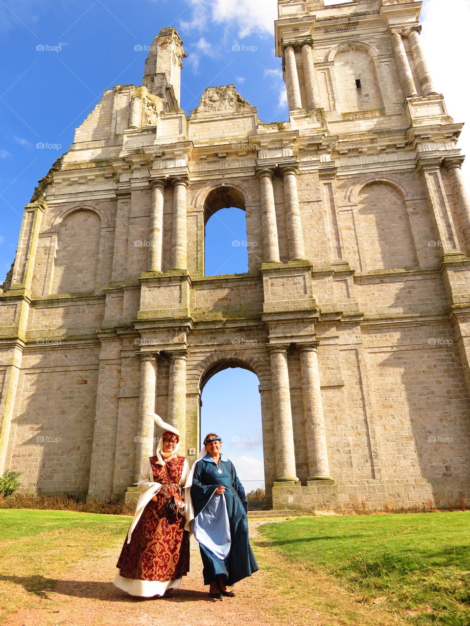 Female tourists walking in front of ruin