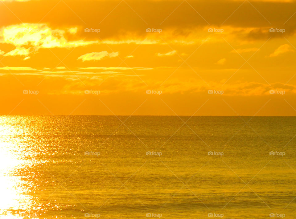 Dramatic sky reflecting on sea