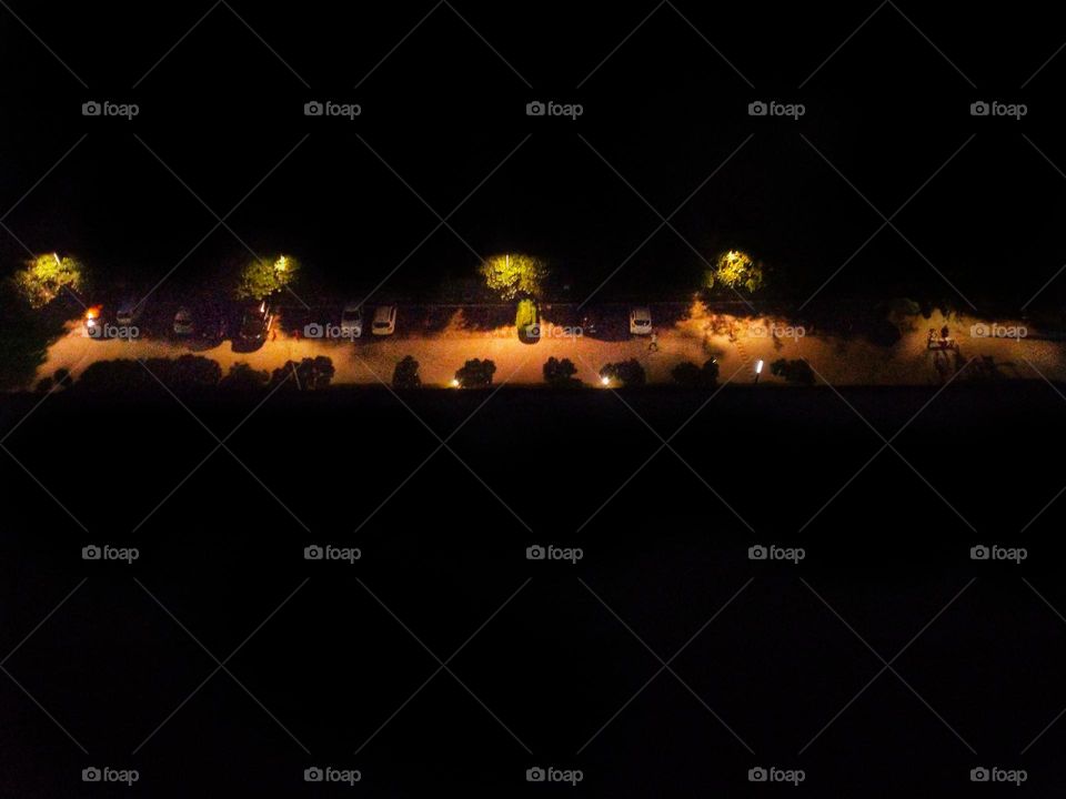 Night view of the INDIAN street , some cars are park and they looking like toy cars 😄 please don't forget to RATE my photo 😉