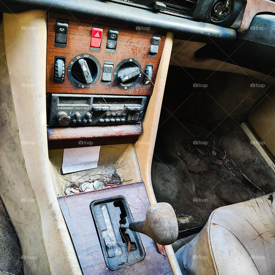 Extremely dirty luxury car interior middle console