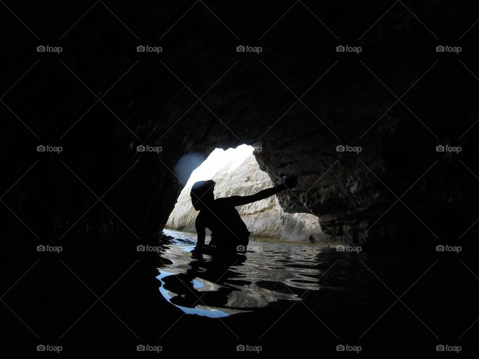 One friend of mine walking into a sea cave