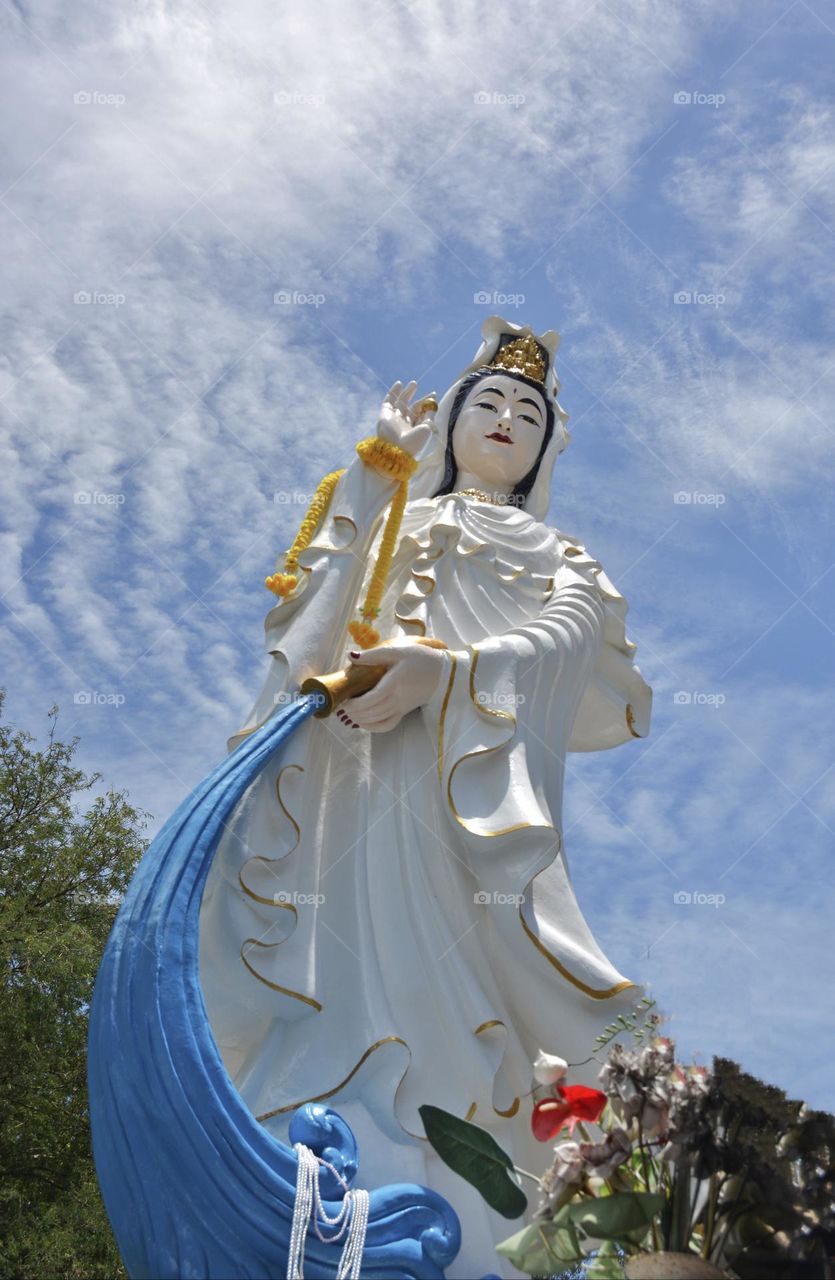 Guanyin statue sky background