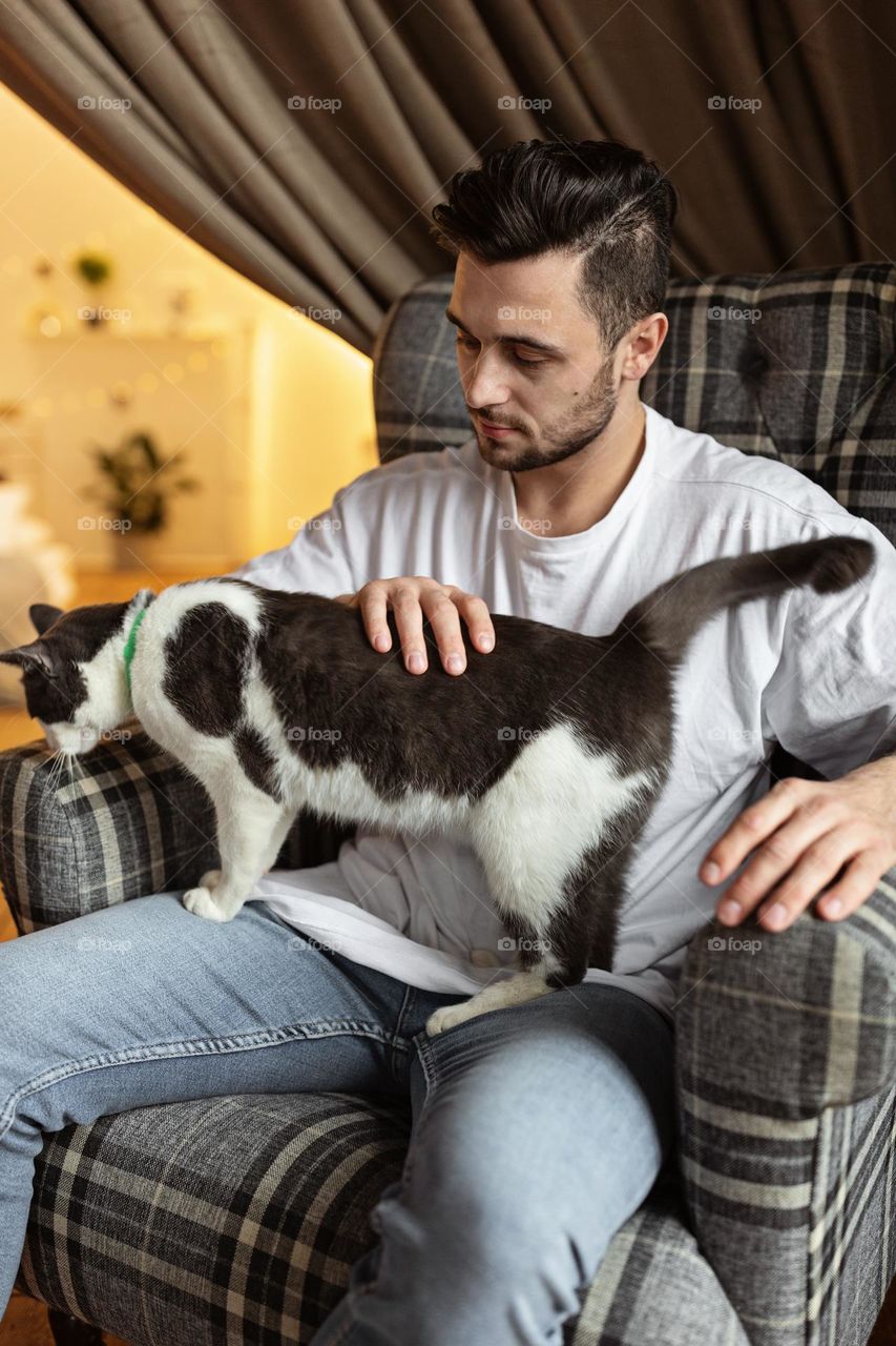 Young man and cat