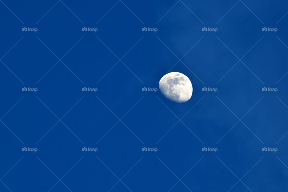 Bright moon on beautiful blue sky