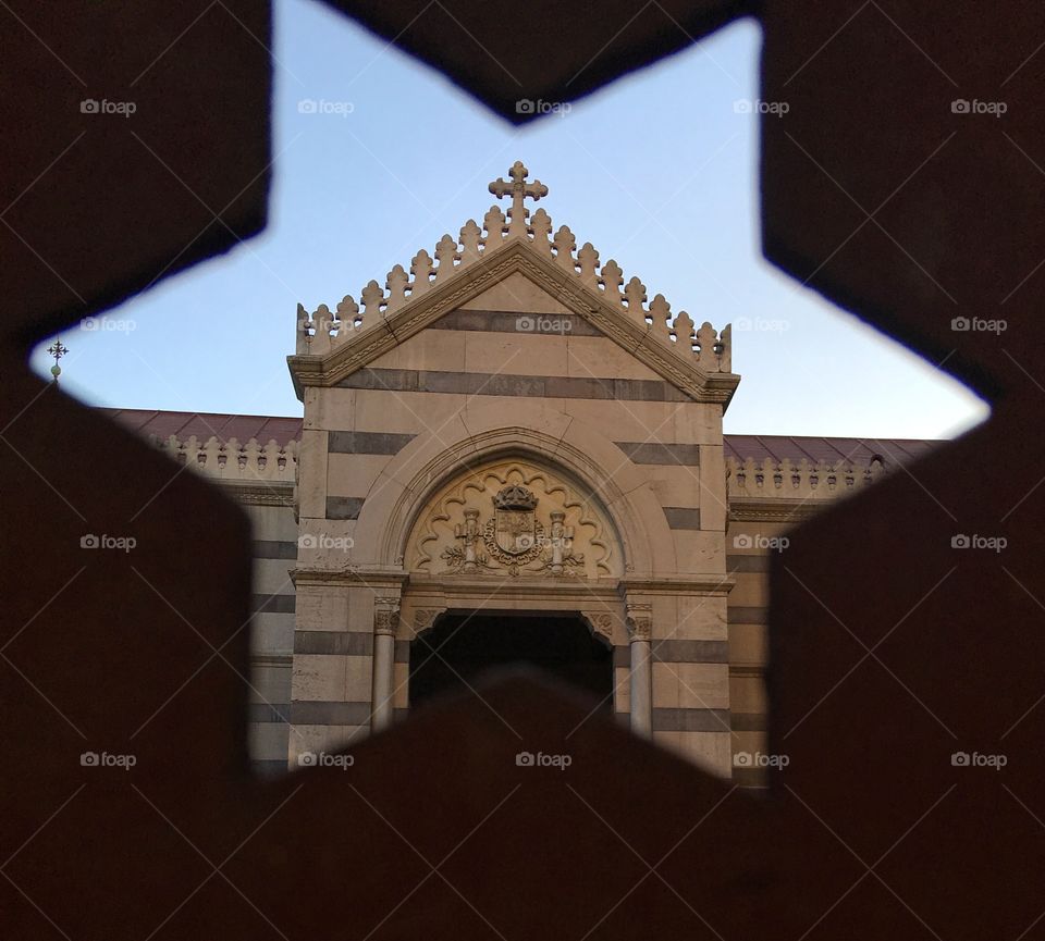 View of church through star shaped wall 