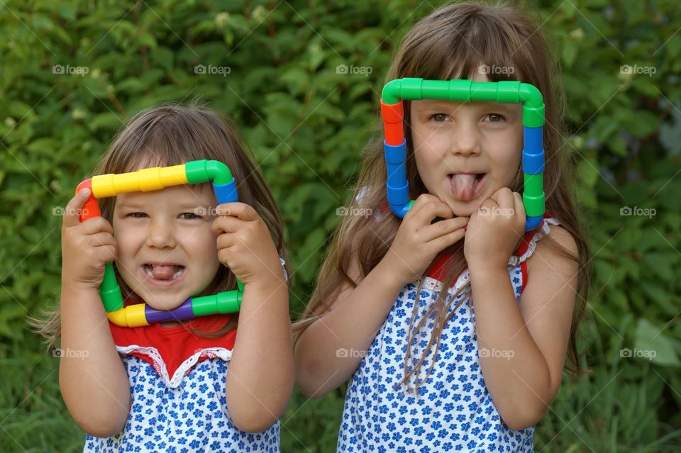 Two funny little sisters girls