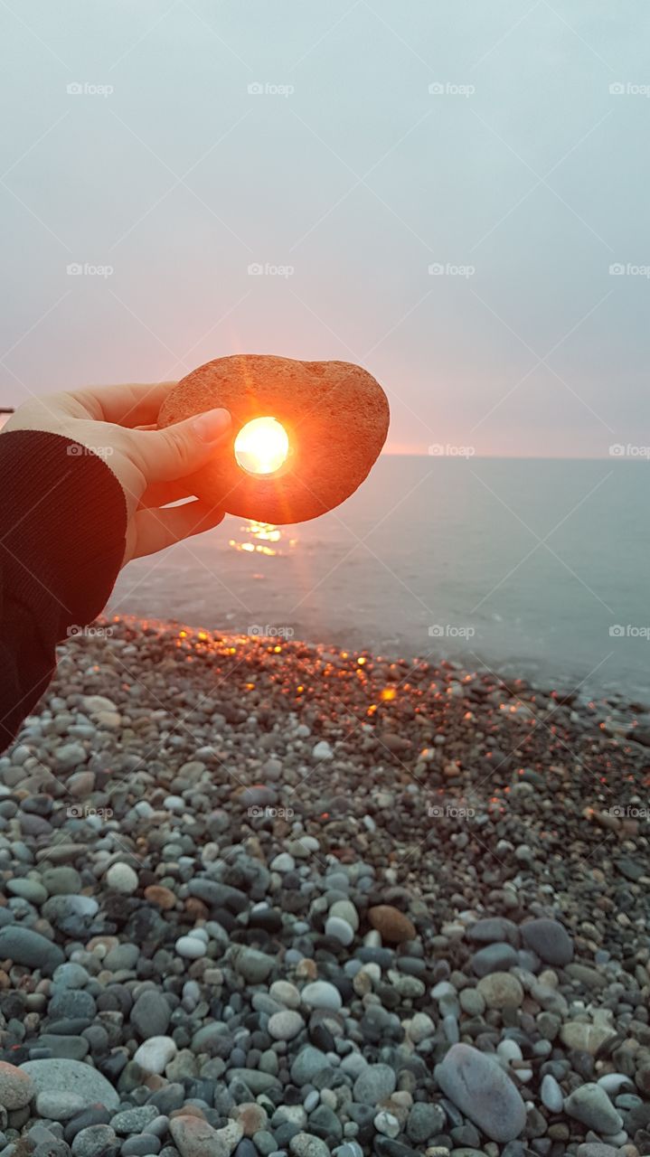 sunset through pebble