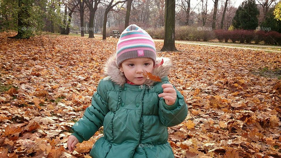 Girl playing with leaf