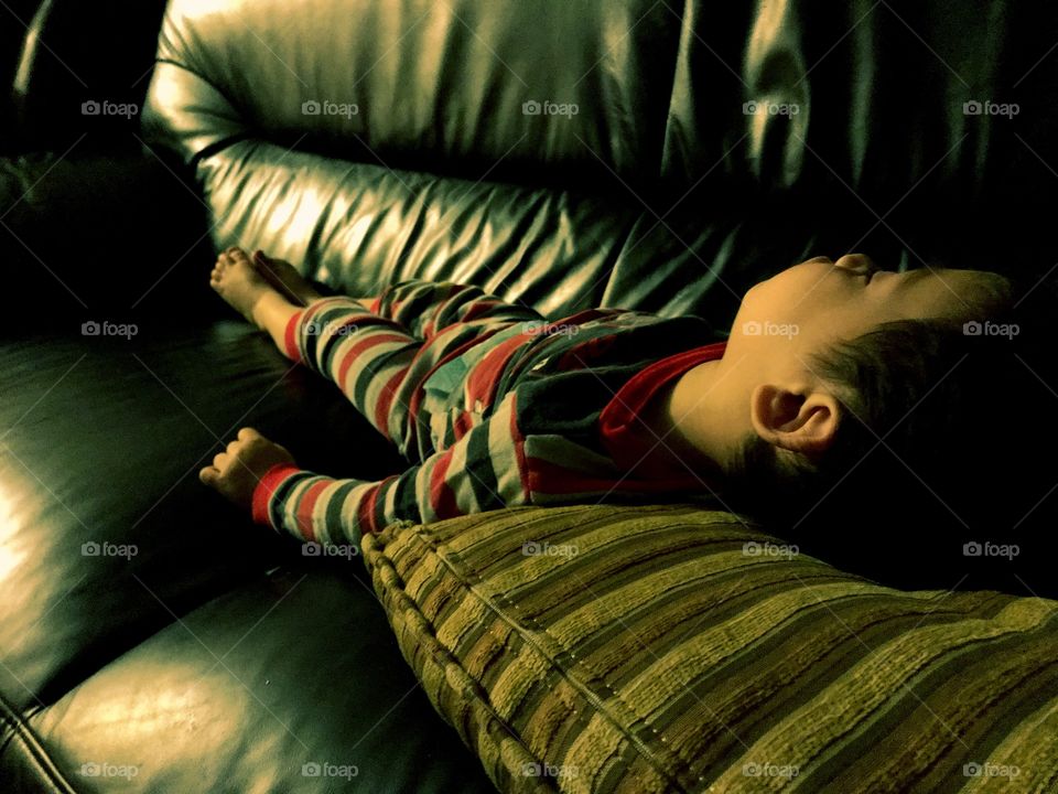 Child sleeping on couch