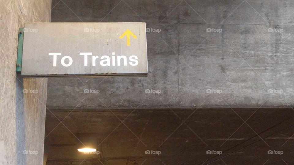 A sign reading "To Trains"