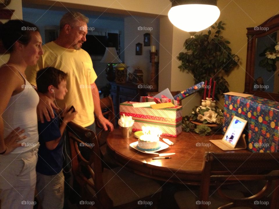 Family celebrating their son's birthday