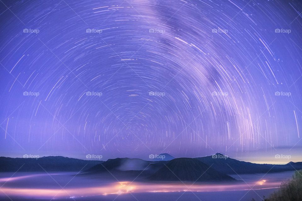 star trails and milkiway on bromo mountain