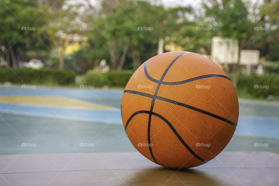 Basketball on the wooden chair Background basketball court and park.