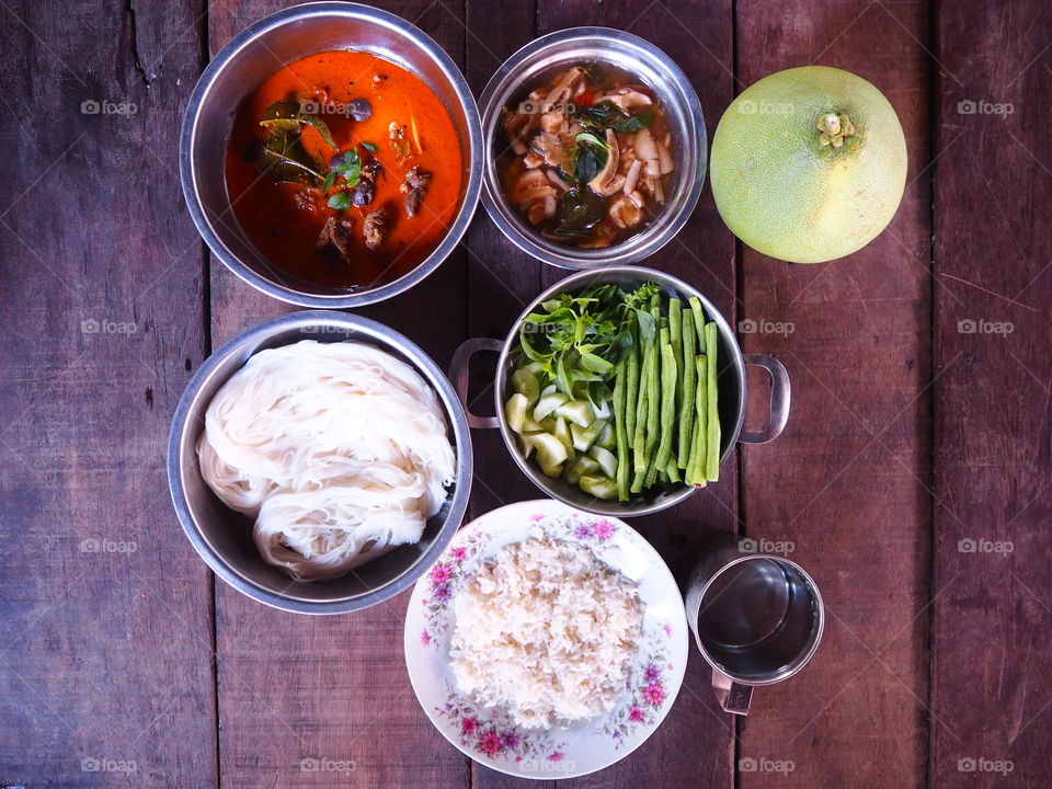 thai food,rice and curry on wood floor