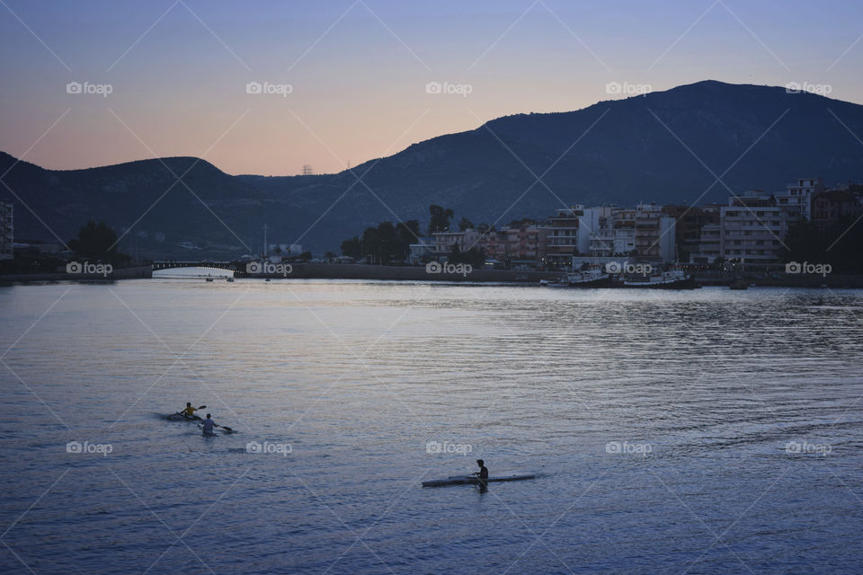 Greece Chalkida. Greece Chalkida Euripus bridge. Children canoeing.