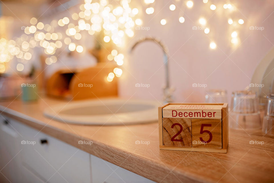 Christmas background with wooden block calendar with the date of December 25